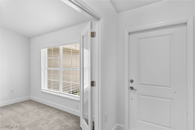 entrance foyer with light carpet