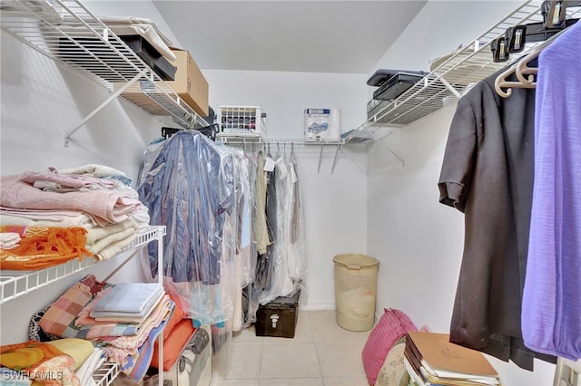 walk in closet featuring light tile patterned flooring