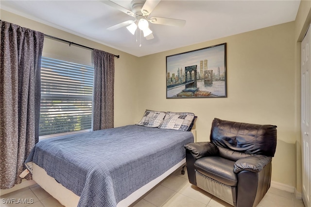 bedroom featuring light tile patterned flooring and ceiling fan