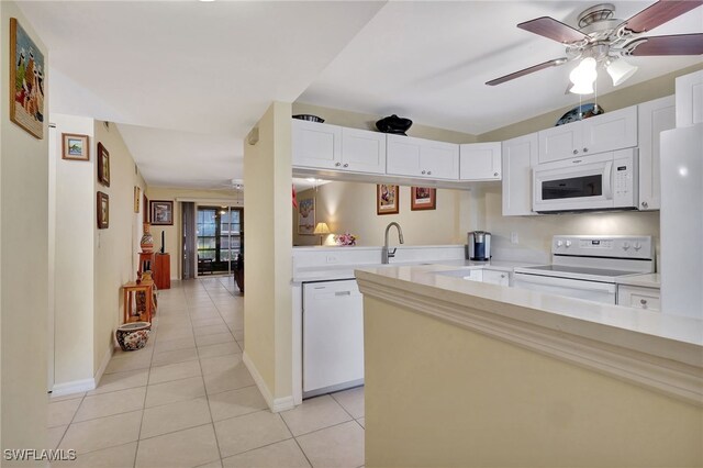 kitchen featuring ceiling fan, light tile patterned floors, white cabinets, and white appliances