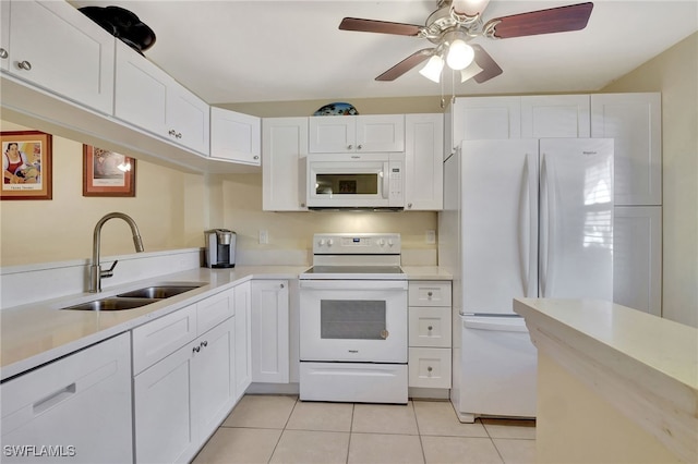 kitchen with white cabinetry, white appliances, sink, and light tile patterned floors