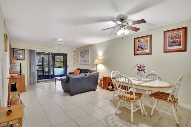 dining room featuring ceiling fan and light tile patterned floors