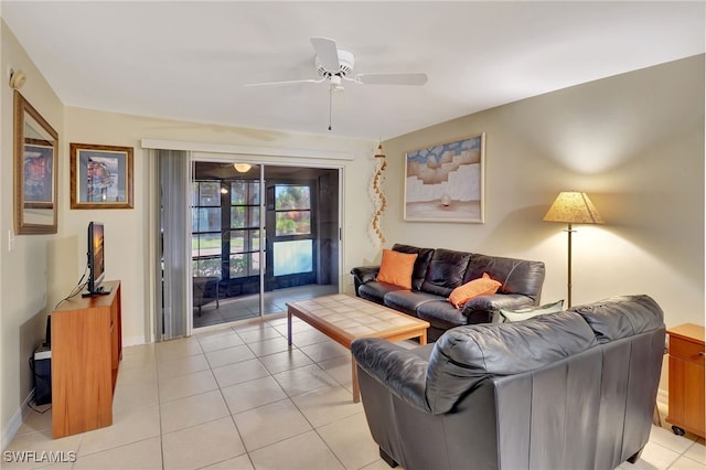 tiled living room with ceiling fan