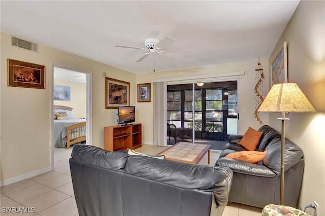 living room with ceiling fan and light tile patterned flooring