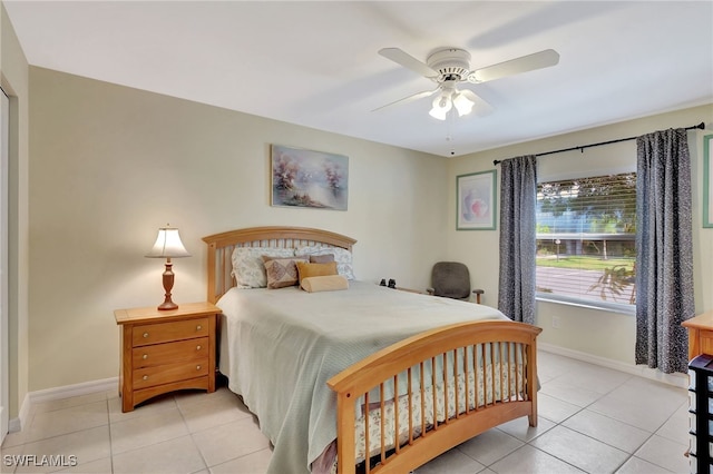 bedroom with light tile patterned flooring and ceiling fan