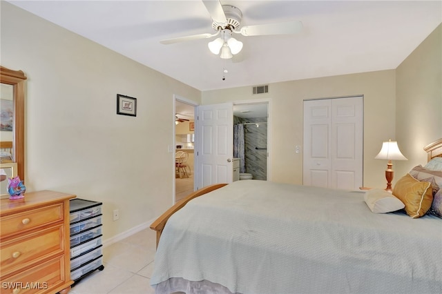 tiled bedroom featuring ceiling fan and a closet