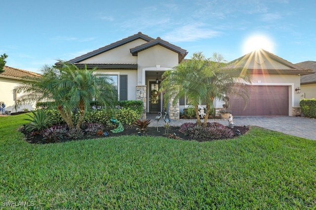 view of front of property with a garage and a front yard