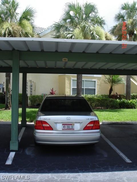 view of car parking with a carport