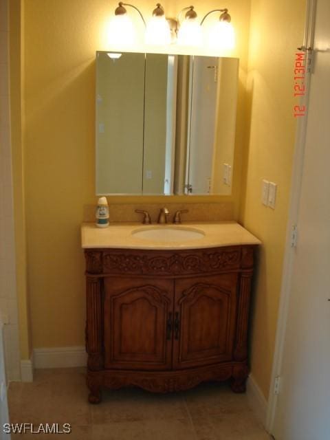 bathroom with vanity and tile patterned flooring