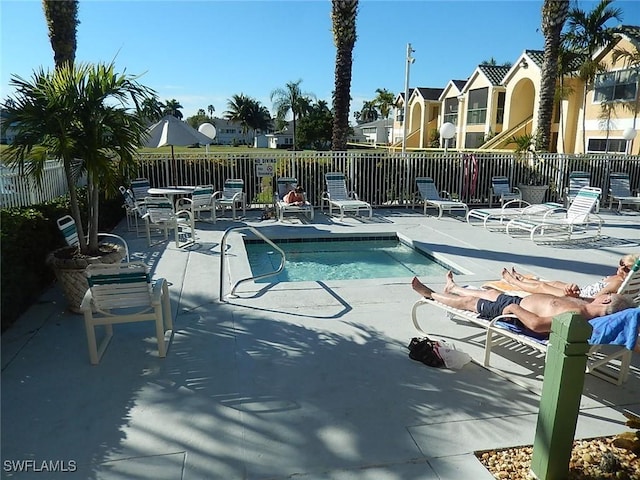 view of swimming pool featuring a patio area