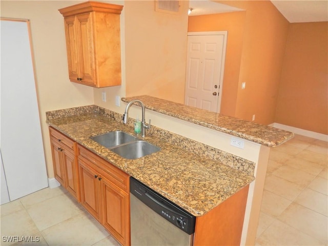 12571 Equestrian Cir Unit 902, Fort Myers, FL 33907 - kitchen featuring stainless steel dishwasher, a peninsula, light stone countertops, and brown cabinets