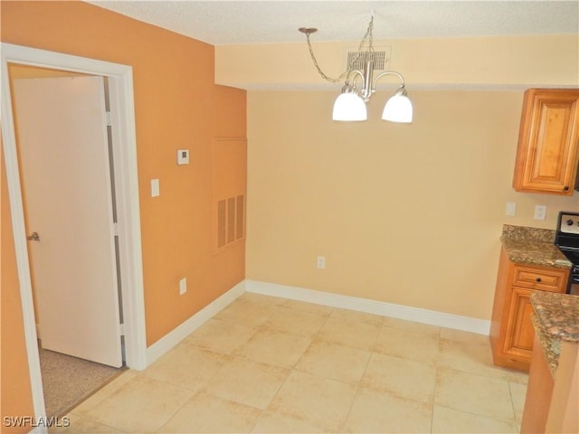 12571 Equestrian Cir Unit 902, Fort Myers, FL 33907 - unfurnished dining area featuring a chandelier and baseboards