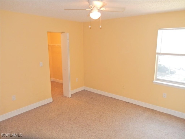 12571 Equestrian Cir Unit 902, Fort Myers, FL 33907 - spare room with ceiling fan and light carpet