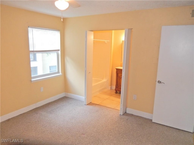 12571 Equestrian Cir Unit 902, Fort Myers, FL 33907 - unfurnished bedroom with light carpet and ensuite bathroom