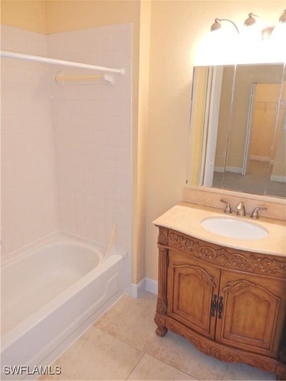 12571 Equestrian Cir Unit 902, Fort Myers, FL 33907 - bathroom with vanity, tub / shower combination, and tile patterned flooring