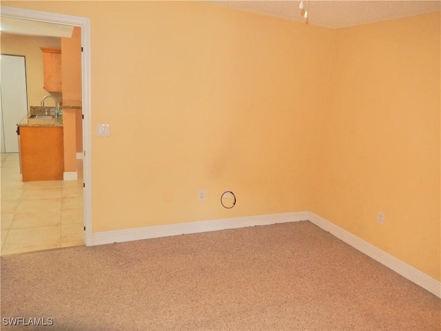 12571 Equestrian Cir Unit 902, Fort Myers, FL 33907 - unfurnished room with a sink and light colored carpet