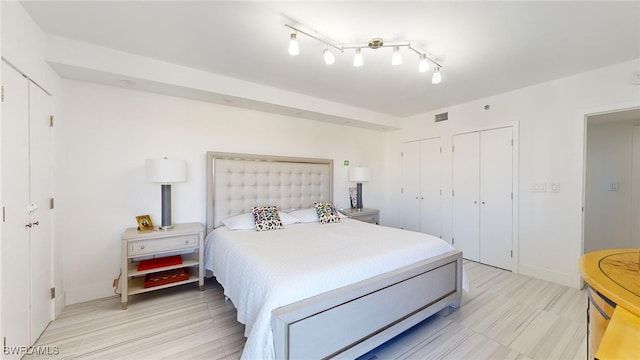 bedroom featuring two closets