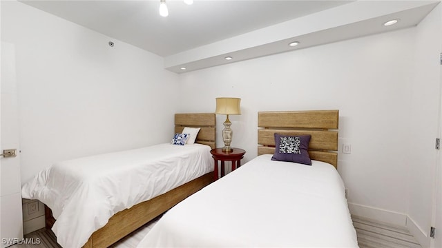 bedroom with wood-type flooring