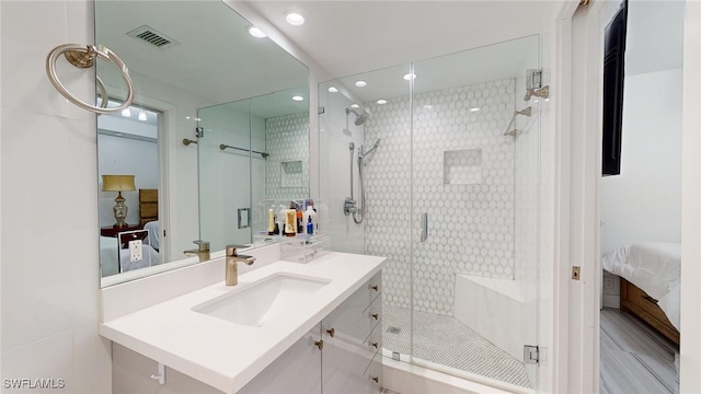 bathroom with vanity and an enclosed shower