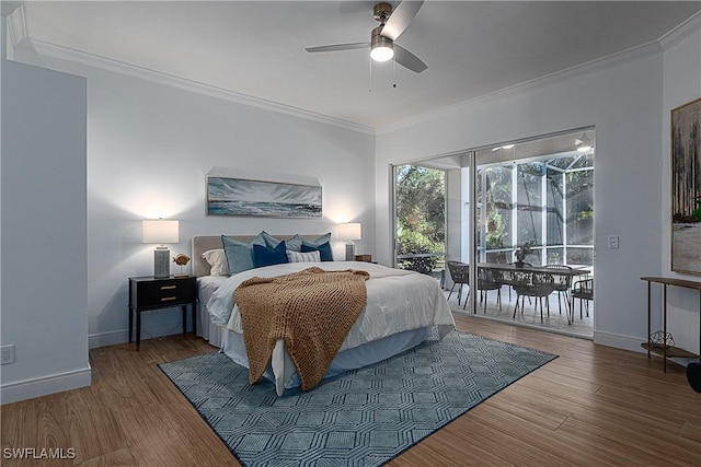 bedroom featuring crown molding, hardwood / wood-style floors, and access to exterior