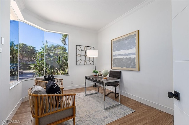 office area with hardwood / wood-style flooring and crown molding