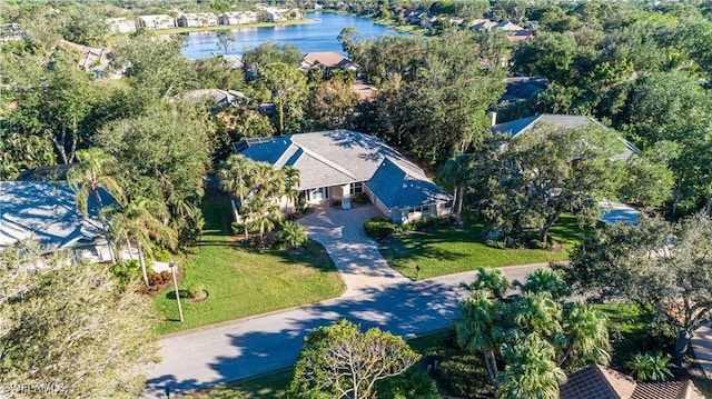 birds eye view of property featuring a water view