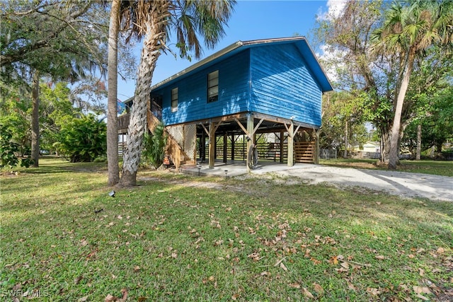 coastal home featuring a front yard