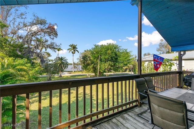 deck featuring a lawn