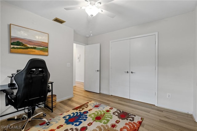 office area featuring light hardwood / wood-style floors and ceiling fan