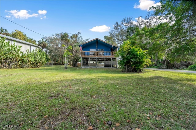 view of yard featuring a deck