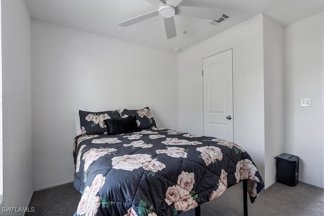 carpeted bedroom with crown molding and ceiling fan