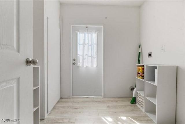 doorway with light hardwood / wood-style floors