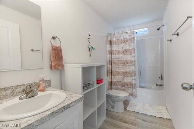 full bathroom with hardwood / wood-style flooring, vanity, toilet, and shower / bath combo