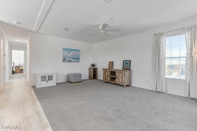 misc room with ceiling fan and carpet flooring