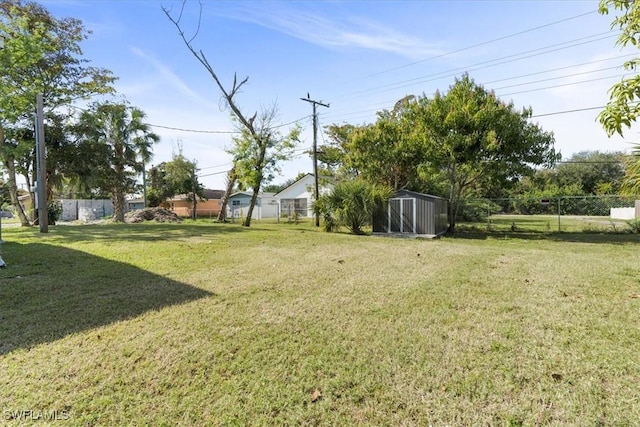 view of yard featuring a storage unit