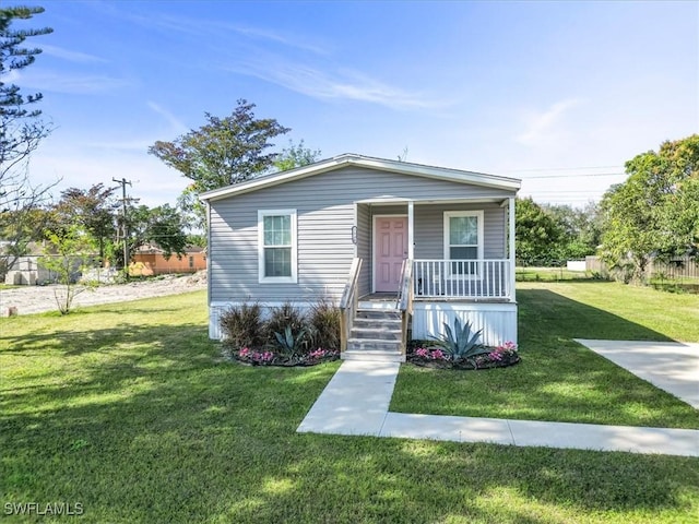 view of front of home featuring a porch and a front yard