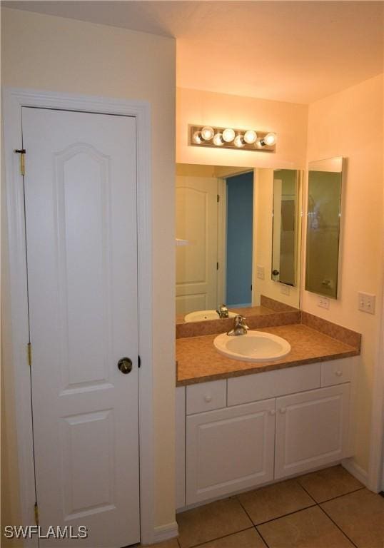 bathroom with vanity and tile patterned flooring