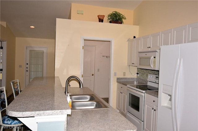 kitchen featuring white cabinetry, sink, white appliances, and backsplash