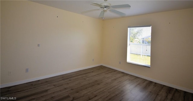 spare room with ceiling fan and dark hardwood / wood-style floors