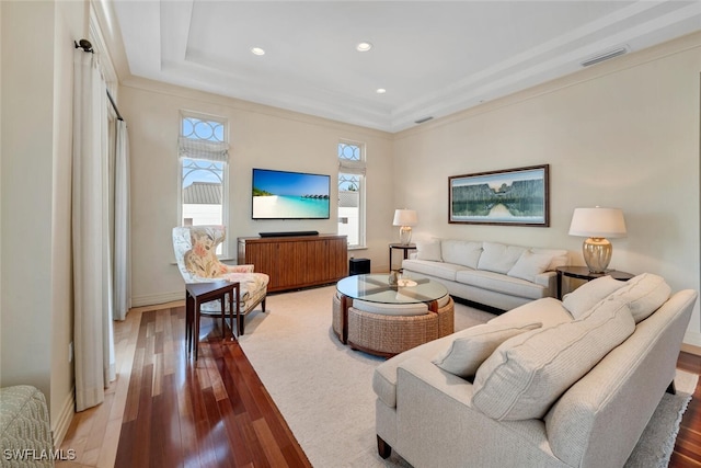 living room featuring hardwood / wood-style floors and ornamental molding