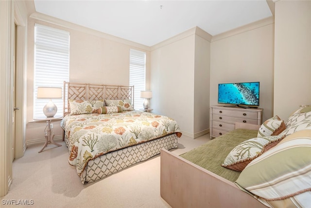 carpeted bedroom featuring crown molding