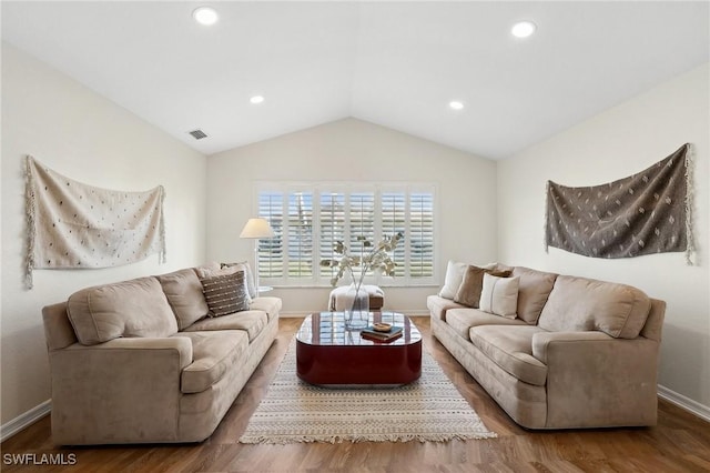 living room with wood-type flooring and lofted ceiling