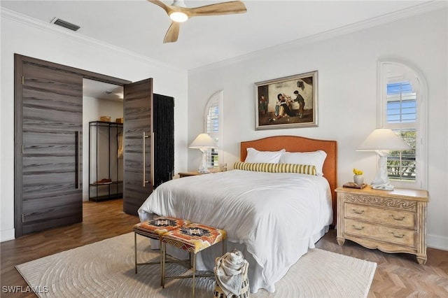 bedroom with ornamental molding, parquet floors, and ceiling fan