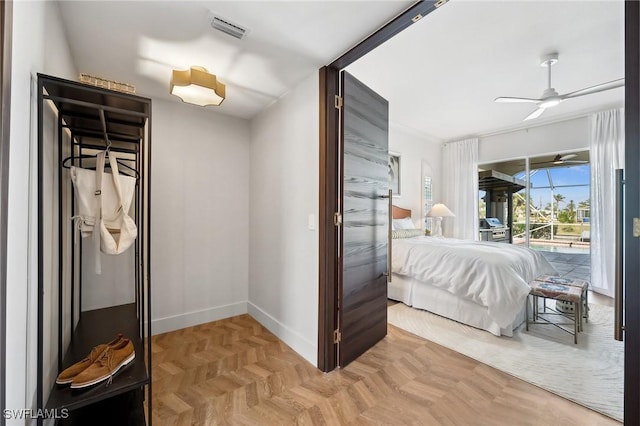 bedroom featuring ceiling fan, parquet flooring, and access to outside