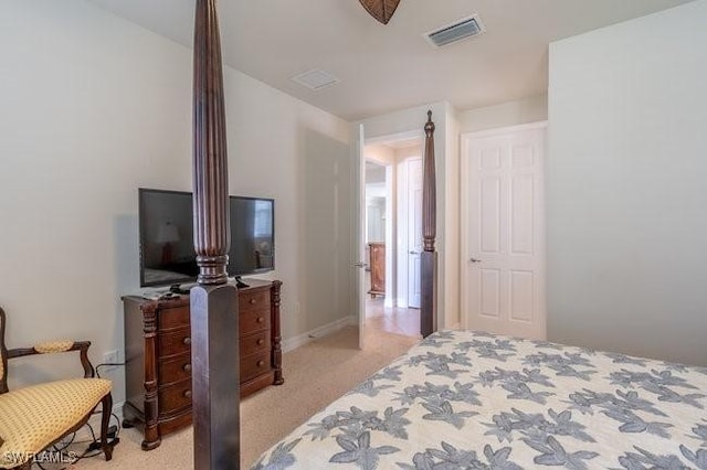 bedroom featuring light carpet