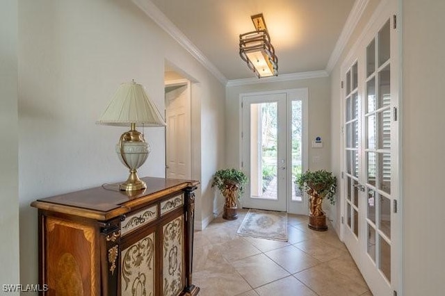 foyer featuring french doors, ornamental molding, and light tile patterned flooring