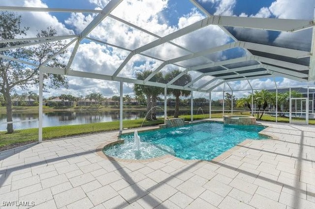 view of pool featuring pool water feature, a water view, glass enclosure, an in ground hot tub, and a patio