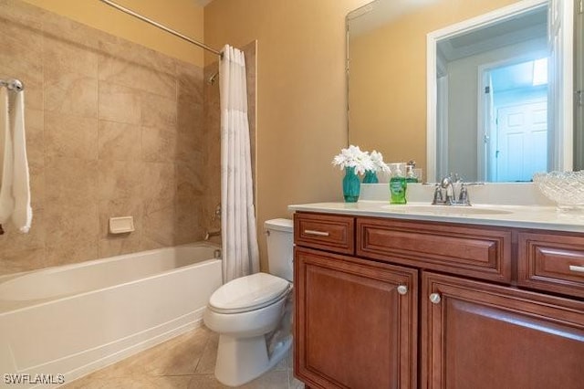 full bathroom with tile patterned flooring, shower / tub combo, vanity, and toilet