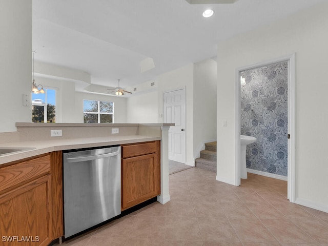 kitchen with light tile patterned floors, hanging light fixtures, dishwasher, and ceiling fan