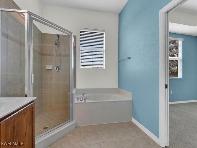 bathroom featuring tile patterned floors, vanity, and independent shower and bath